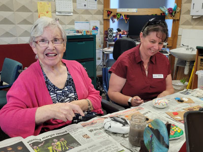 Resident painting rocks
