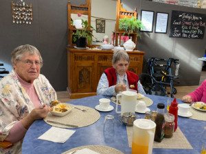 Enjoying lunch on pyjama day at Iona